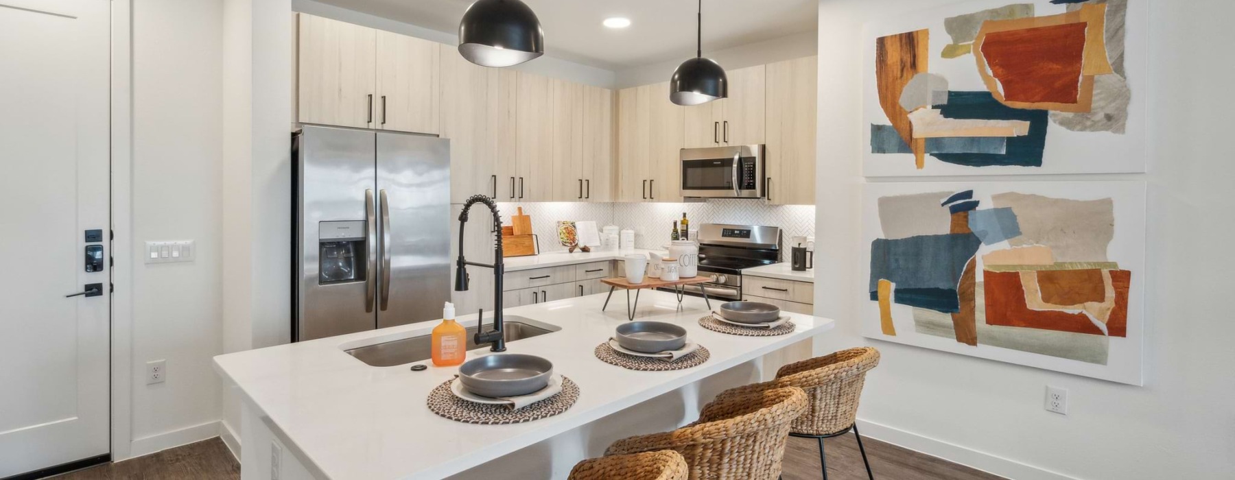 a kitchen with white cabinets
