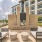 Chic outdoor lounge area with elegant brick fireplace, stylish seating, and modern architecture at our new apartments in Austin