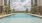 Inviting outdoor pool area with modern lounge chairs and scenic landscape views, perfect for relaxation and leisure in Easton Park